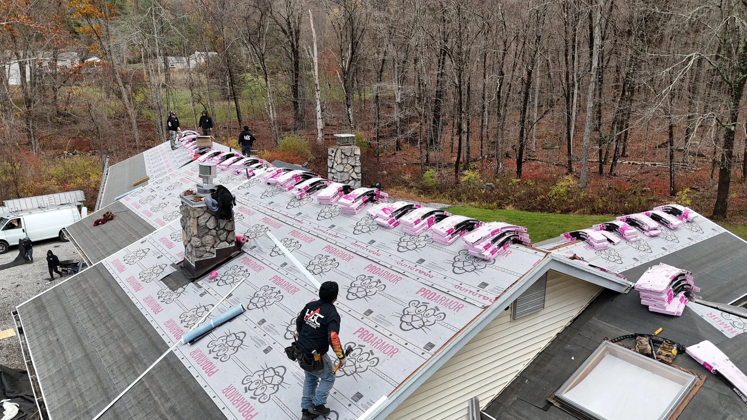 New England house with a completed Helio GC roof — the envelope we size heating and air against